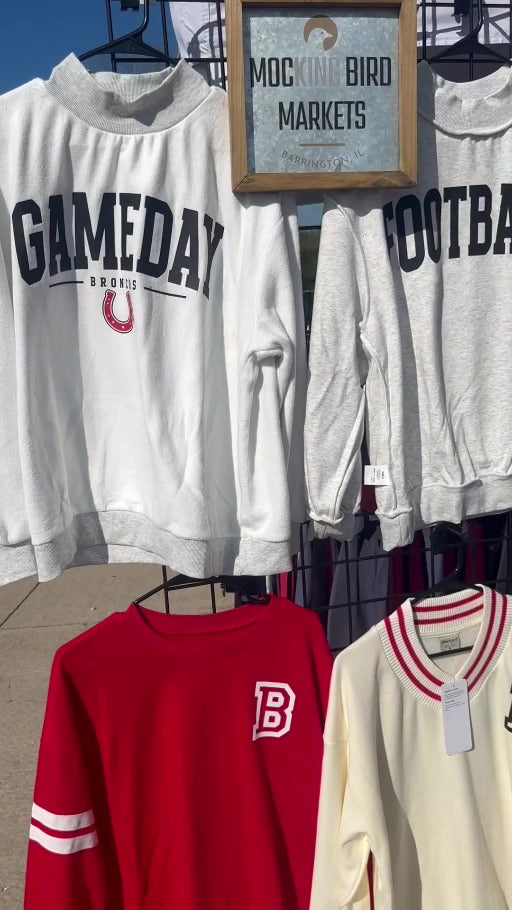 Custom apparel displayed on a pop-up rack